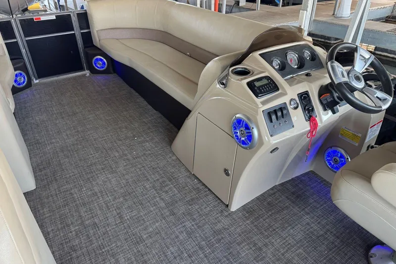 Slide: The Image of Interior of a 2015 Crest 22 Crest I boat with modern dashboard and seating. - 25