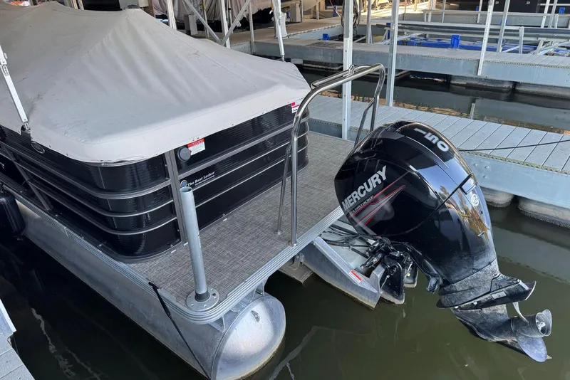 Slide: The Image of 2015 Crest 22 Crest I pontoon boat with Mercury outboard motor at dock. - 31