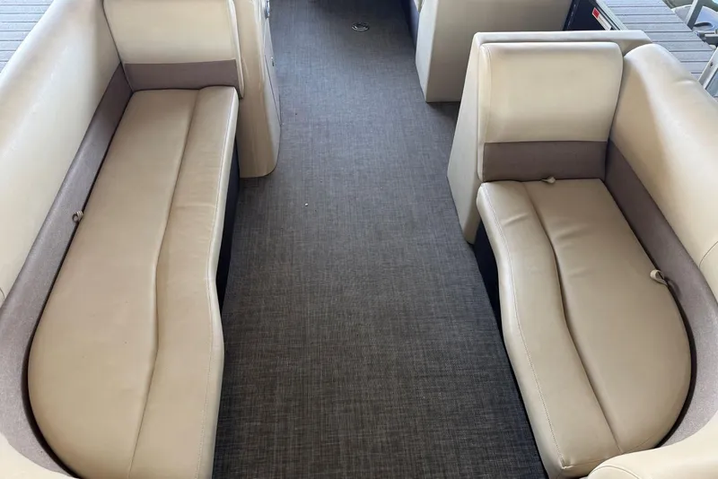 Slide: The Image of 2015 Crest 22 Crest I boat interior with beige seating and gray flooring. - 8