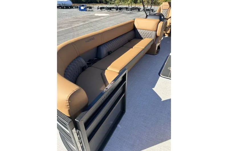 Slide: The Image of 2026 Harris Cruiser 250 LUX pontoon boat with luxurious tan seating and sleek design. - 3