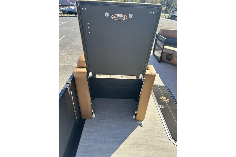 Slide: The Image of 2026 Harris Cruiser 250 LUX boat interior with open storage compartment. - 6