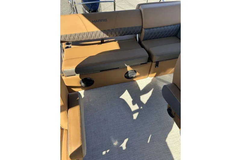 Slide: The Image of Luxurious seating on 2026 Harris Cruiser 250 LUX pontoon boat, featuring tan upholstery. - 7