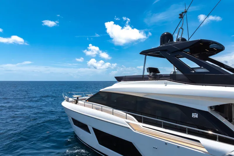 Slide: The Image of Luxury Ferretti Yachts 670, 2022 model, cruising on open sea under clear blue sky. - 14