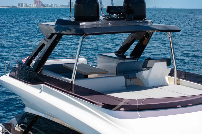 Slide: The Image of Luxury 2022 Ferretti Yachts 670 on open sea, showcasing sleek design and spacious deck. - 15