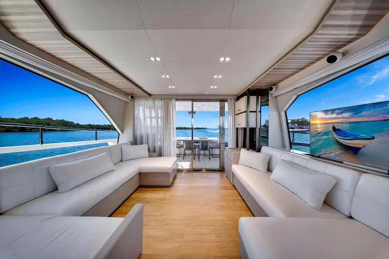 Slide: The Image of Luxurious interior of 2022 Ferretti Yachts 670 with elegant seating and scenic views. - 29