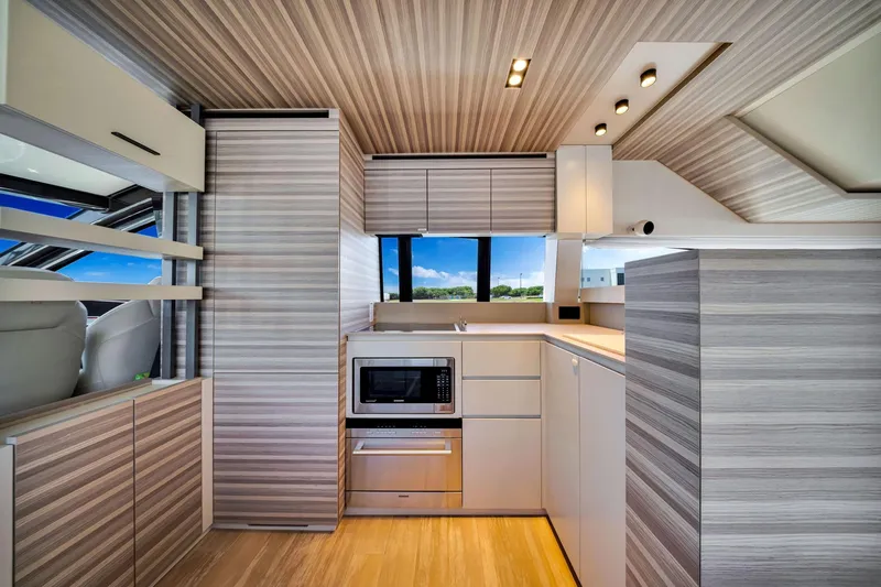 Slide: The Image of Modern kitchen interior of 2022 Ferretti Yachts 670, featuring sleek cabinetry and appliances. - 32