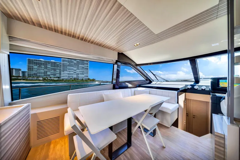 Slide: The Image of Luxurious interior of 2022 Ferretti Yachts 670 with ocean view and modern dining area. - 34