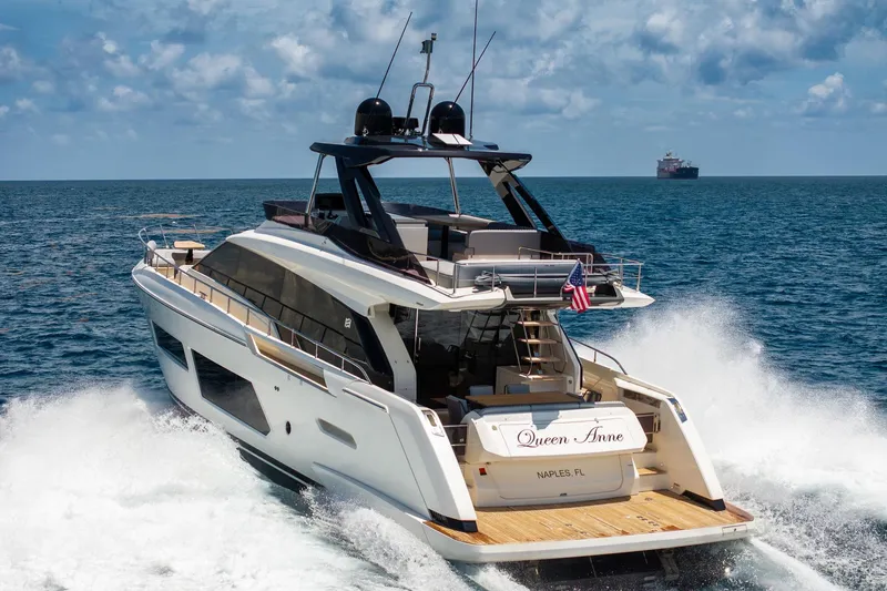 Slide: The Image of Luxury 2022 Ferretti Yachts 670 cruising on open sea, rear view. - 5