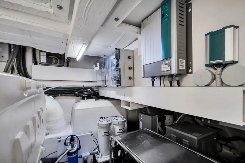 Slide: The Image of Engine room of 2022 Ferretti Yachts 670, showcasing electrical systems and components. - 62