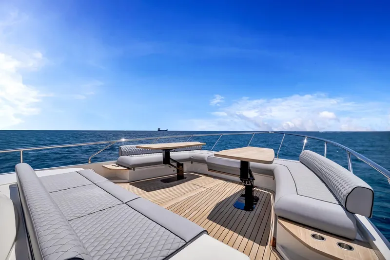 Slide: The Image of Luxurious 2022 Ferretti Yachts 670 deck with elegant seating and ocean view. - 9