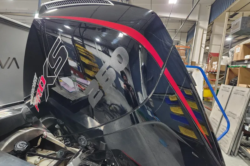 Slide: The Image of Outboard motor on Avalon Venture 85 Center Console Fish, 2026 model, in a workshop setting. - 1