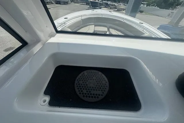 Slide: The Image of 2025 Sportsman Open 232 Center Console boat interior with speaker detail. - 12