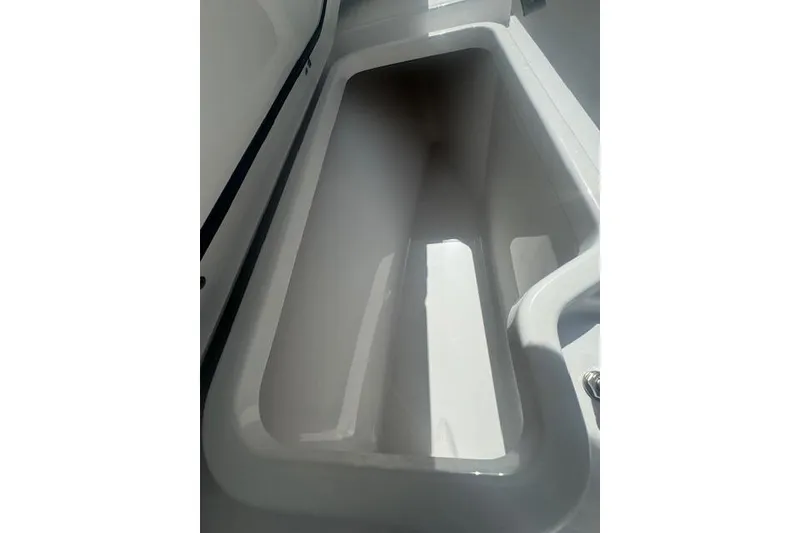 Slide: The Image of 2025 Sportsman Open 232 Center Console storage compartment, spacious and sleek design. - 15