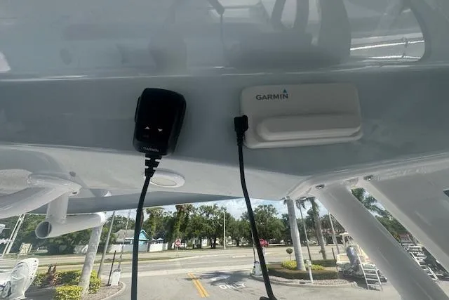 Slide: The Image of 2025 Sportsman Open 232 Center Console with Garmin electronics installed on the dashboard. - 16