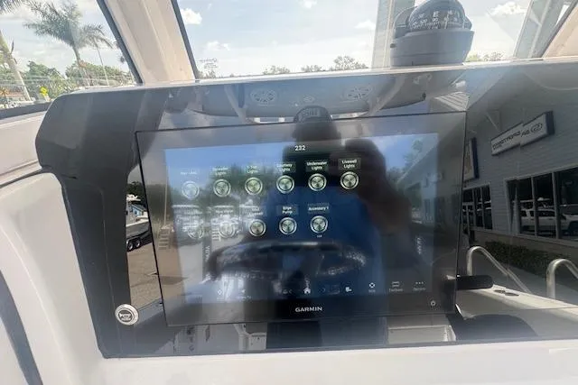 Slide: The Image of 2025 Sportsman Open 232 Center Console with Garmin display, showcasing advanced navigation features. - 7