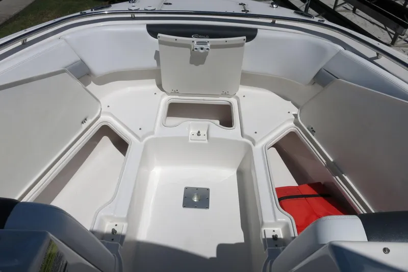 Slide: The Image of 2021 Robalo R247 Dual Console boat interior with storage compartments. - 15