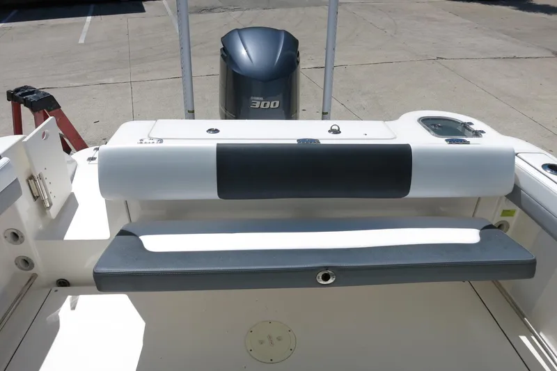 Slide: The Image of 2021 Robalo R247 Dual Console boat with Yamaha 300 engine, featuring rear seating and storage. - 19