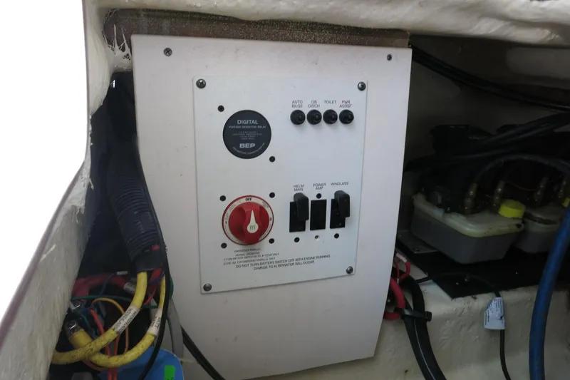 Slide: The Image of Control panel of a 2021 Robalo R247 Dual Console boat, featuring switches and wiring. - 27