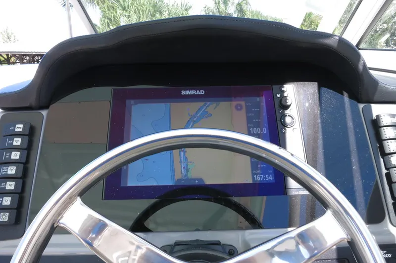 Slide: The Image of Dashboard of 2021 Robalo R247 Dual Console with Simrad navigation display. - 30