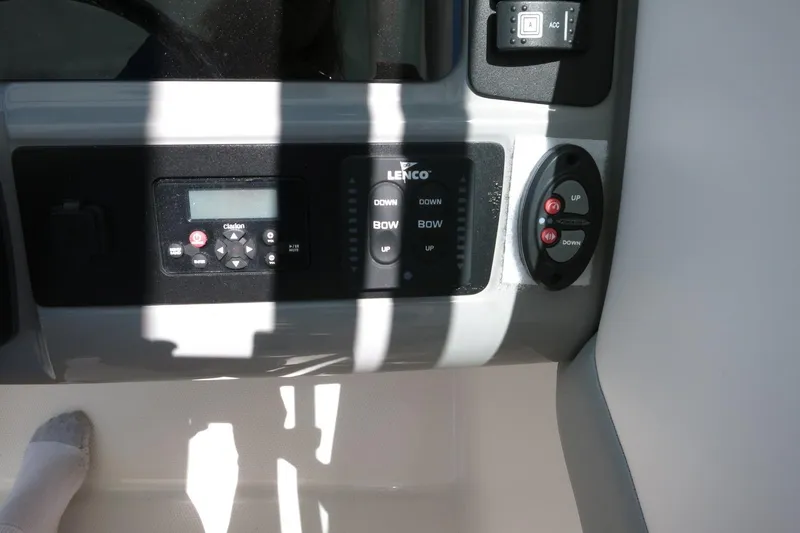 Slide: The Image of Control panel of 2021 Robalo R247 Dual Console boat with Lenco and Clarion systems. - 35