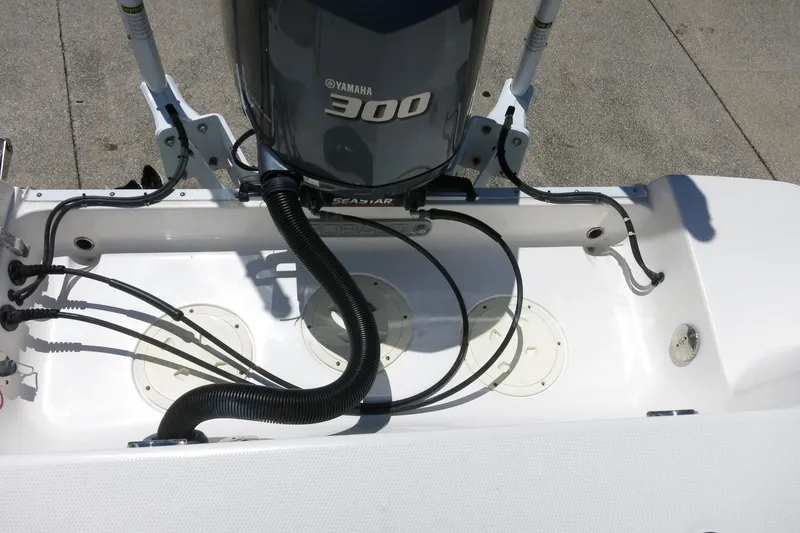 Slide: The Image of 2021 Robalo R247 Dual Console with Yamaha 300 engine, rear view. - 43