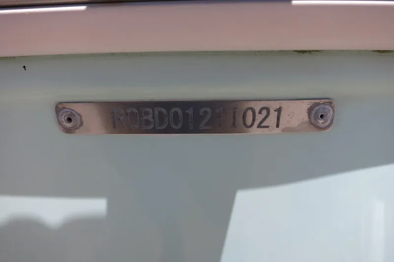 Slide: The Image of 2021 Robalo R247 Dual Console boat identification plate. - 47