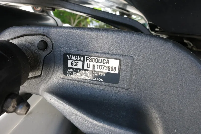 Slide: The Image of Yamaha F300UCA engine label on 2021 Robalo R247 Dual Console boat. - 48