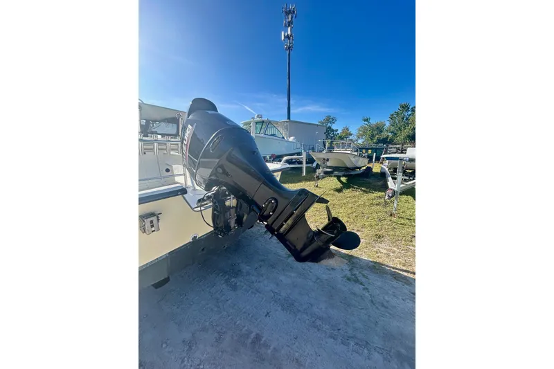 Slide: The Image of 2017 May-Craft 1800CC boat with outboard motor in a sunny outdoor setting. - 8