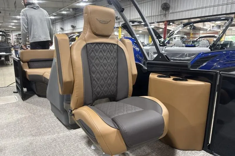 Slide: The Image of 2026 Bennington 26 MFBSF pontoon boat with sleek green and tan design. - 12