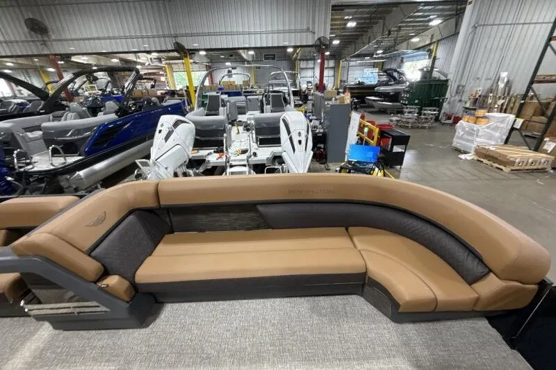 Slide: The Image of Luxurious interior of 2026 Bennington 26 MFBSF pontoon boat with tan seating and LED lighting. - 15