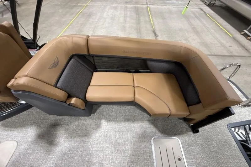 Slide: The Image of 2026 Bennington 26 MFBSF pontoon boat interior with tan seating and cup holders. - 18