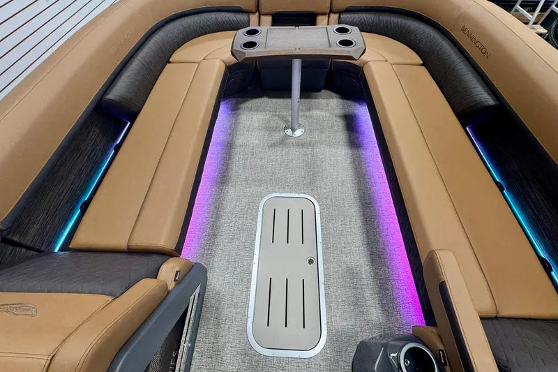 Slide: The Image of Luxurious interior of 2026 Bennington 26 MFBSF boat with ambient lighting and plush seating. - 22