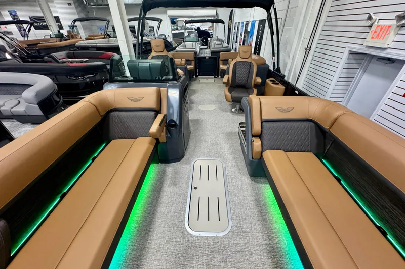 Slide: The Image of 2026 Bennington 26 MFBSF pontoon boat interior with luxurious seating and ambient lighting. - 23