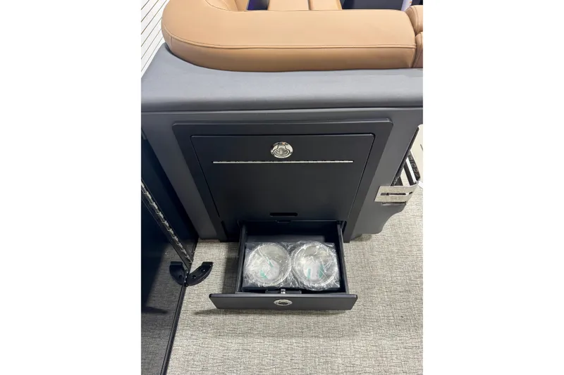 Slide: The Image of 2026 Bennington 26 MFBSF boat interior with storage drawer and seating. - 24