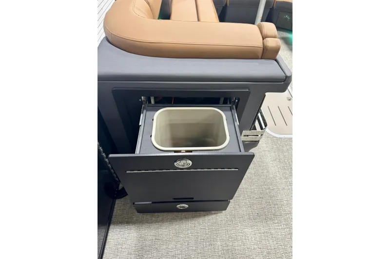 Slide: The Image of 2026 Bennington 26 MFBSF boat interior with pull-out storage compartment. - 25