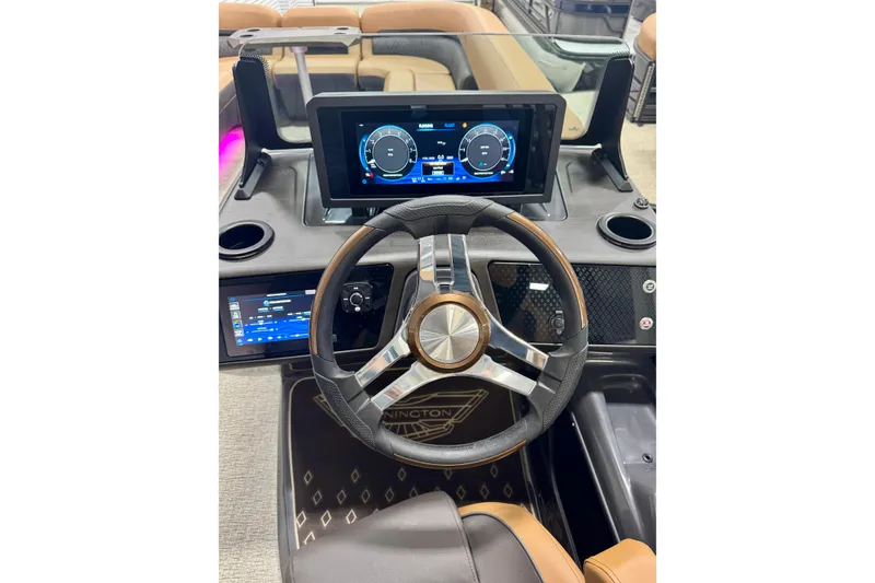 Slide: The Image of 2026 Bennington 26 MFBSF boat dashboard with modern steering wheel and digital displays. - 28