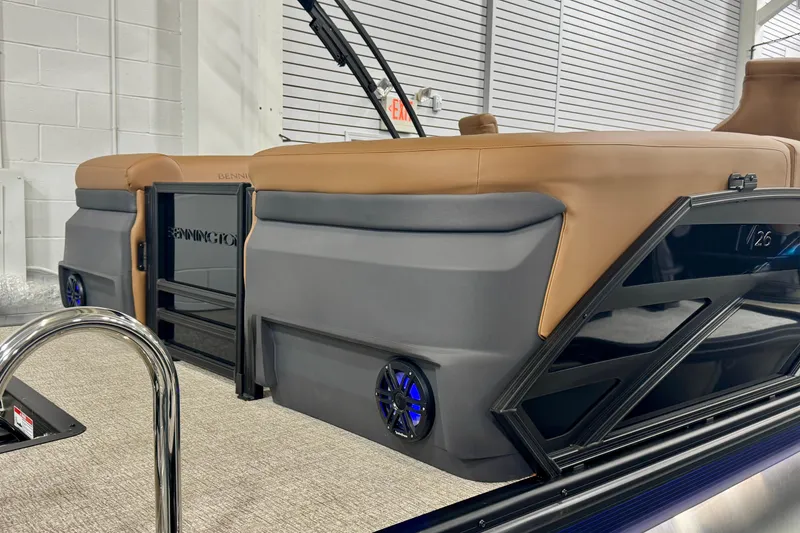 Slide: The Image of 2026 Bennington 26 MFBSF pontoon boat with tan seating and sleek design. - 31