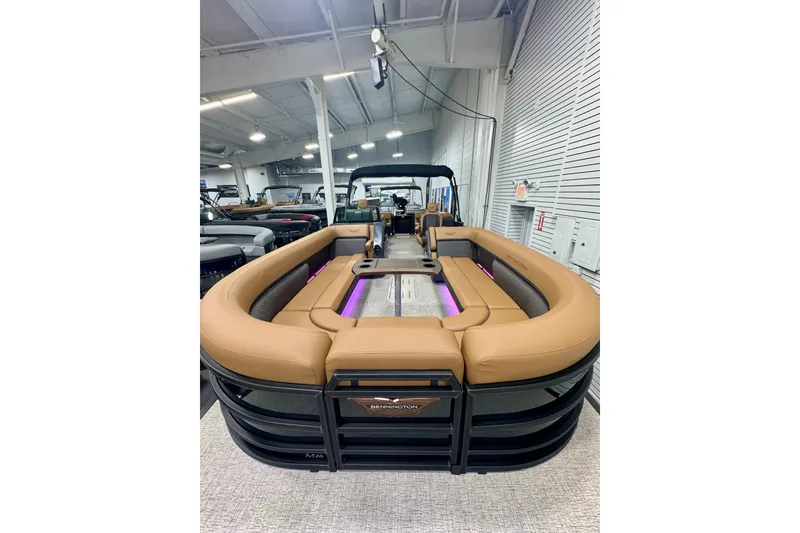Slide: The Image of 2026 Bennington 26 MFBSF pontoon boat with luxurious tan seating and modern design. - 36