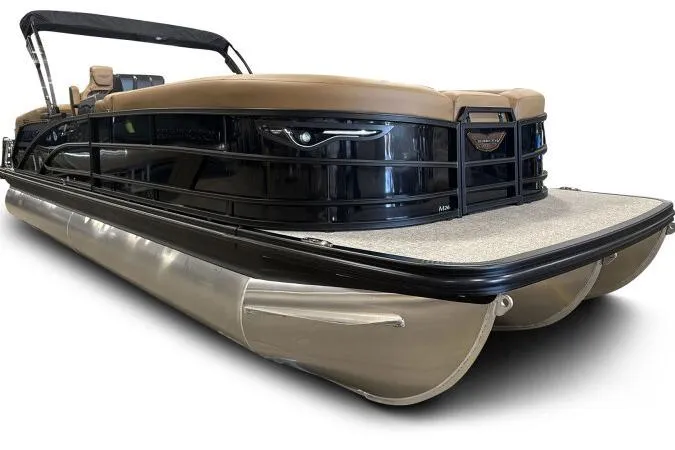 Slide: The Image of 2026 Bennington 26 MFBSF pontoon boat in showroom, featuring sleek design and tan seating. - 9