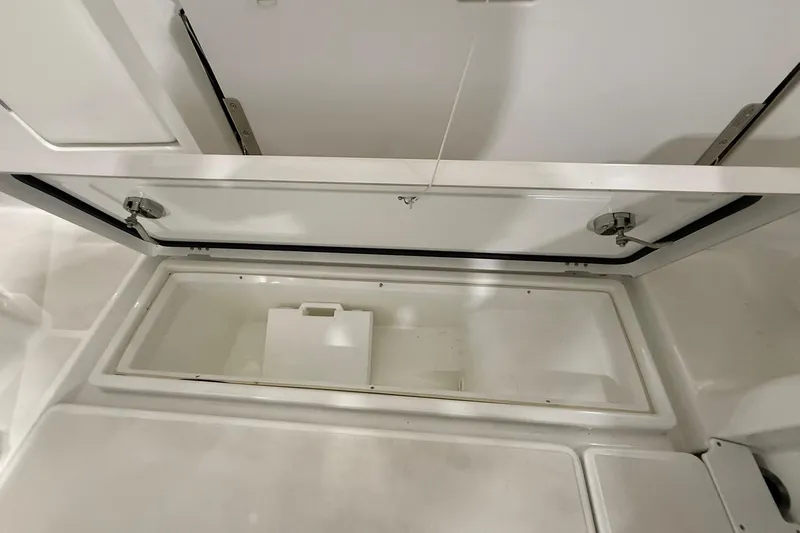 Slide: The Image of 2024 Jeanneau NC Sport 795 Series 2 storage compartment, open and empty. - 10