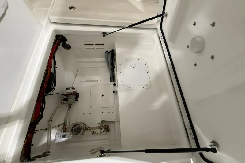 Slide: The Image of 2024 Jeanneau NC Sport 795 Series 2 boat interior compartment with wiring and components. - 12