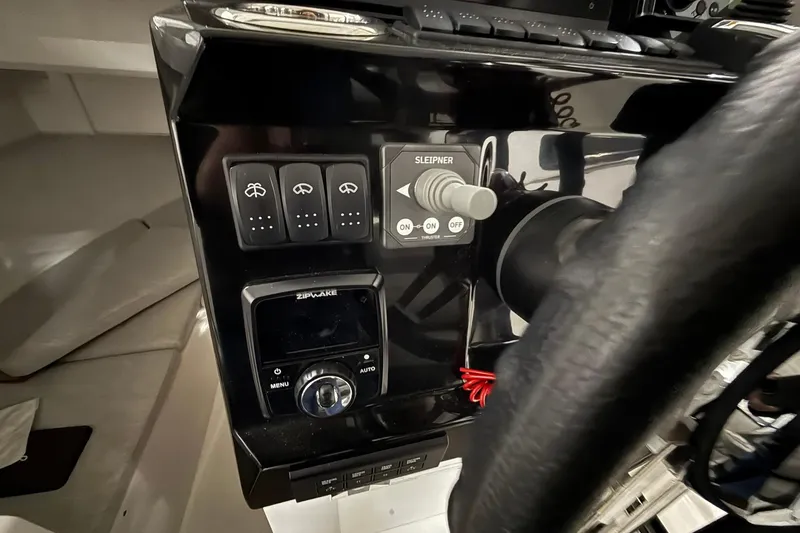 Slide: The Image of Control panel of 2024 Jeanneau NC Sport 795 Series 2 boat with steering wheel. - 26