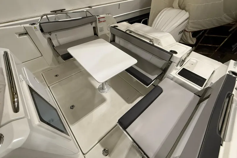 Slide: The Image of 2024 Jeanneau NC Sport 795 Series 2 boat interior with seating and table. - 6