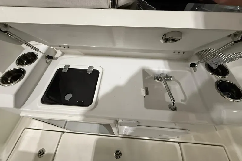 Slide: The Image of 2024 Jeanneau NC Sport 795 Series 2 boat kitchen with sink and stove. - 9