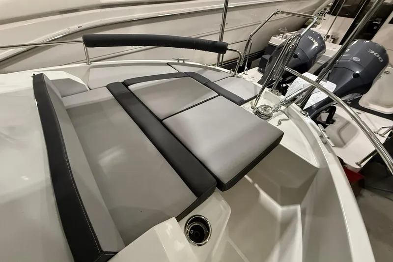 Slide: The Image of 2024 Jeanneau NC Sport 795 Series 2 boat interior with cushioned seating and dual engines. - 15