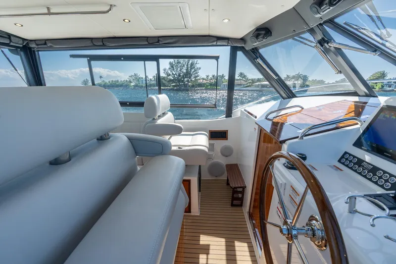 Slide: The Image of Luxurious interior of 2025 MJM 42 yacht with modern helm and seating. - 21