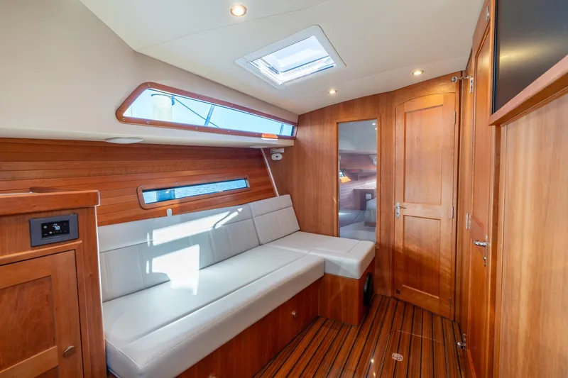 Slide: The Image of Luxurious interior of 2025 MJM 42 yacht with wooden finish and modern seating. - 25