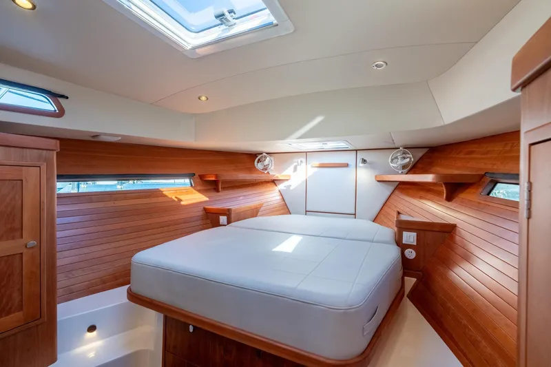 Slide: The Image of Luxurious cabin interior of 2025 MJM 42 yacht with wood paneling and skylight. - 4