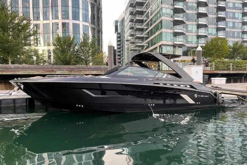 The Image of 2022 Cruisers Yachts 338 South Beach Edition Bow Rider docked in urban marina setting. - 0