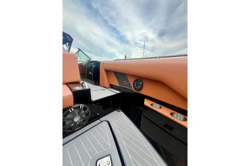 Slide: The Image of 2022 Cruisers Yachts 338 South Beach Edition Bow Rider interior with sleek design and cup holders. - 19